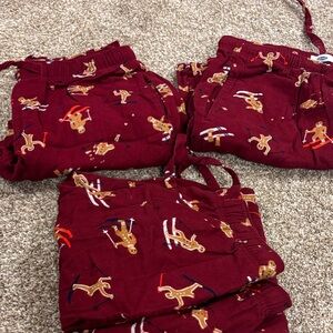 Three pairs of Old navy men’s gingerbread men holiday pj bottoms